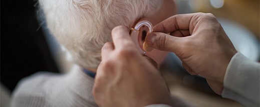 Elderly Man Enjoying The Benefits Of Hearing Aid Plans With Truehearing And netWell